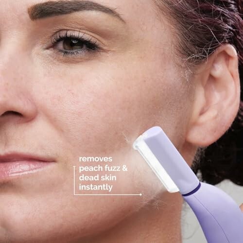 A close-up of a woman using the Sonicsmooth Pro+ Dermaplaning System on her face.