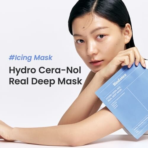 Woman holding a Bioblance Hydro Cera-Nol Real Deep Mask package.