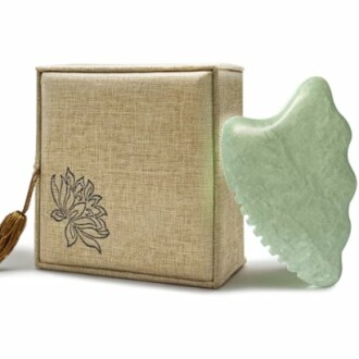 Green jade massage tool with decorative box