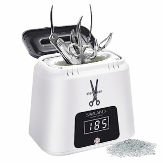 Nail tool sterilizer with instruments inside and temperature display.