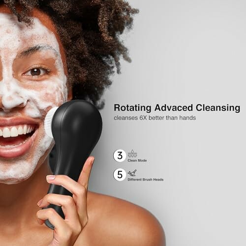 Person using a rotating cleansing brush on the face