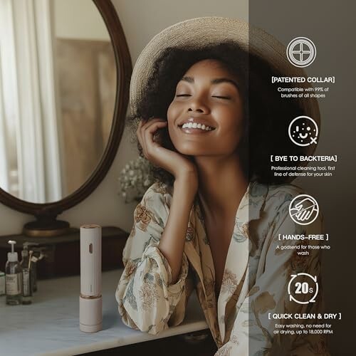 Woman smiling with a skincare device on a bathroom counter.